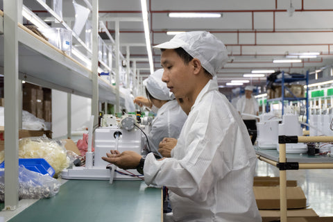 Team members working with product components